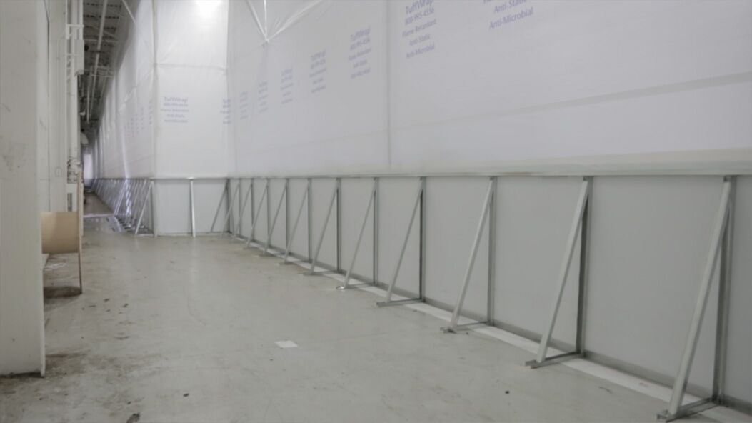 Frameless Walls Protected Retailer During Renovations - TuffWrap Hybrid Walls